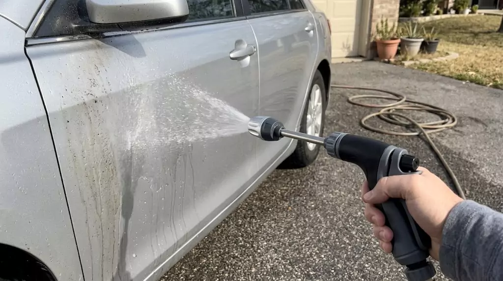 Power Blast test on a silver family sedan — soft fan spray hitting the driver’s door directly
